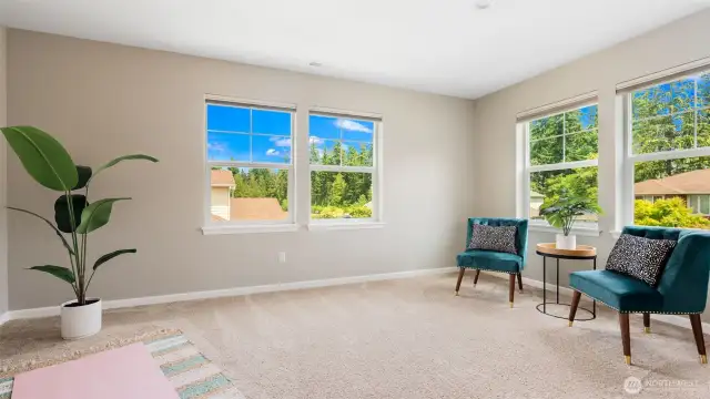 The upstairs bonus room is an absolute gem - bright, spacious, and full of possibility. With windows lining the walls and natural light pouring in, it’s the kind of space that sparks creativity and invites connection. Movie nights, epic game sessions, art projects, or just a cozy spot to lounge - it’s all happening up here.
