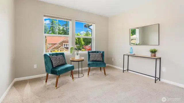 The upstairs bonus room overlooks the quiet street below, giving you a front-row seat to the friendly rhythm of the neighborhood. It’s bright, open, and full of good energy - perfect for whatever you dream up next.