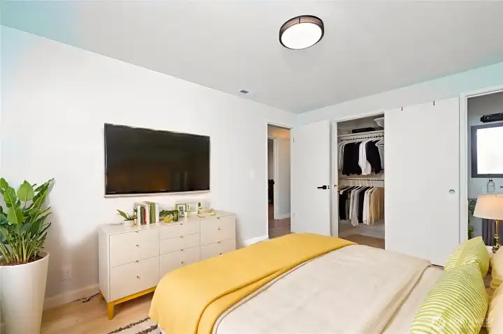 Large virtually staged primary bedroom