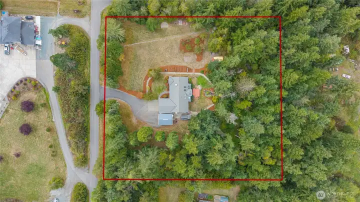 A birds eye view of this lovely home, over 2300 sqft feet and 2.5 level acres with plenty of room to expand as the drainfield is offsite! A rare find in this coveted area.