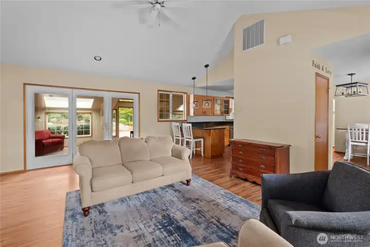 A wonderful open concept living area! Pendulum lighting in the kitchen over the breakfast bar. See virtual tour link with 3D walkthrough video and interactive floorplans.