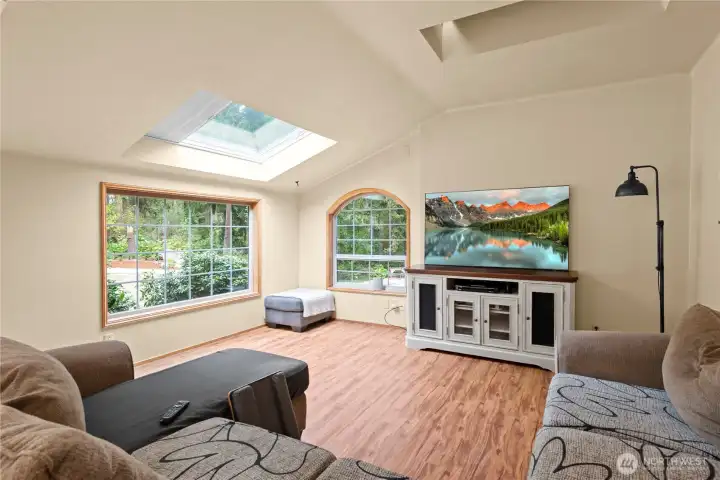 Large windows gather in the views of the back yard, a lovely family room for creating memories for a lifetime!