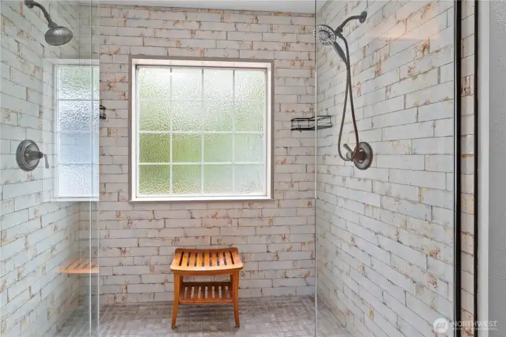 New large walk in shower, tiled surround, two shower heads and frameless glass doors!