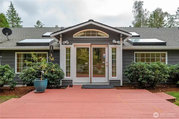Gorgeous back deck, with lovely French doors leading to the sunroom.