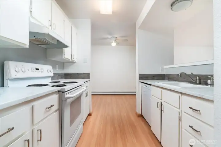Light, bright, and clean kitchen ready for your next meal.