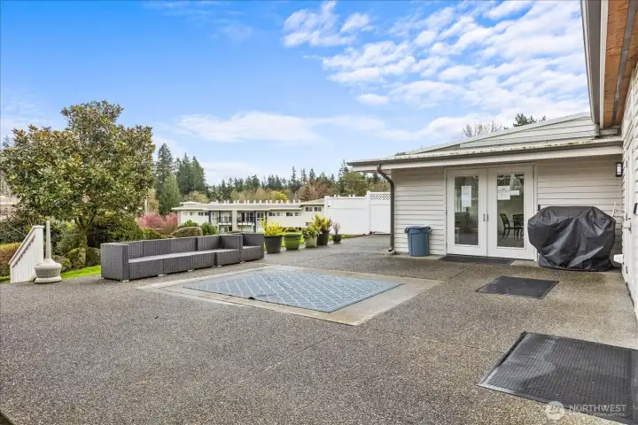 Gathering Area, complete with outdoor sofa, Dining Table & BBQ