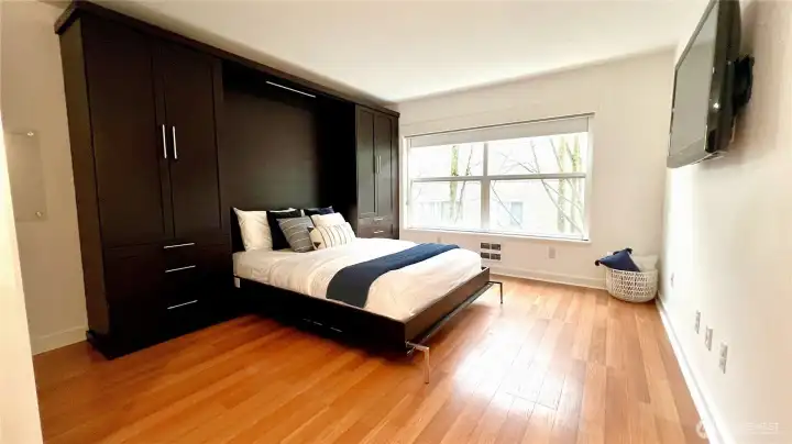 Light streams into the unit through these large picture windows, fitted with newer blinds.