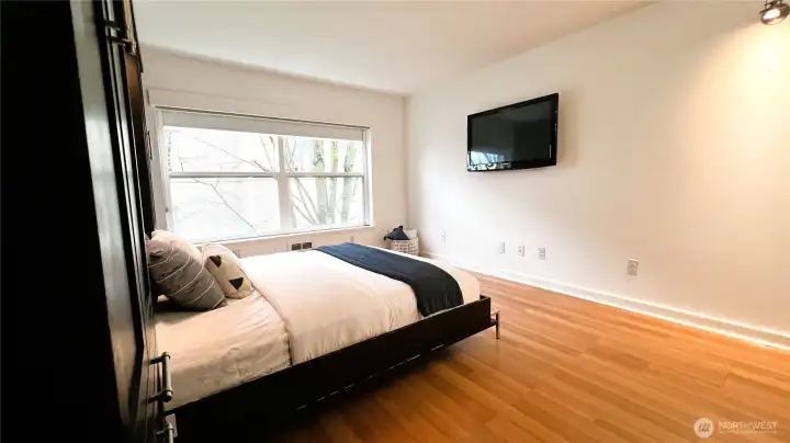 Easy to care for laminate plank flooring flows through the main room and hallway.