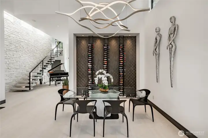 Formal dining room featuring chandler from Milan Italy. Wallpaper is handmade wood from the Maya Collection (Indonesia).