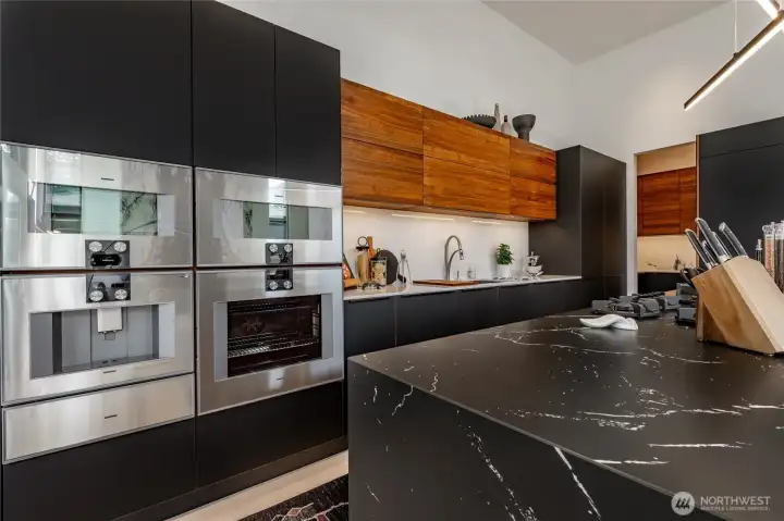 Gaggenau coffee maker, steam/convection oven, microwave, conventional oven, and vacuum sealer.