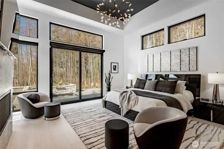 Primary bedroom walking out onto your patio into your sunken spa.