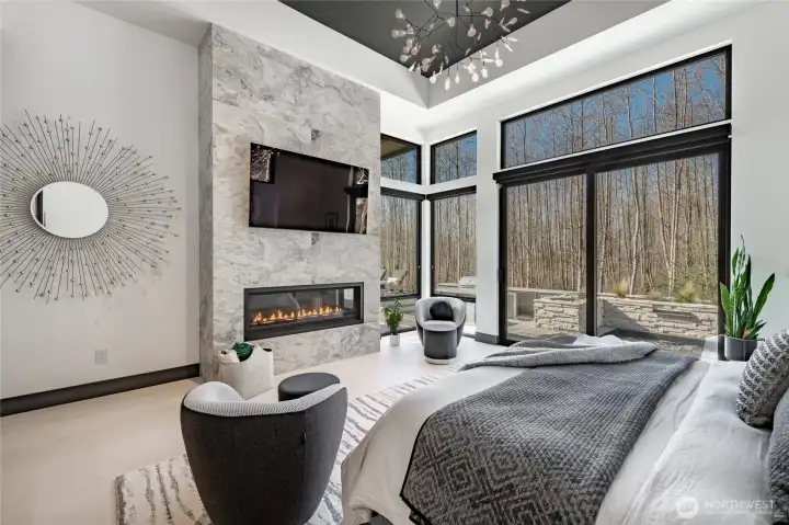 Primary fireplace with mounted TV.  Blackout blinds for added privacy.