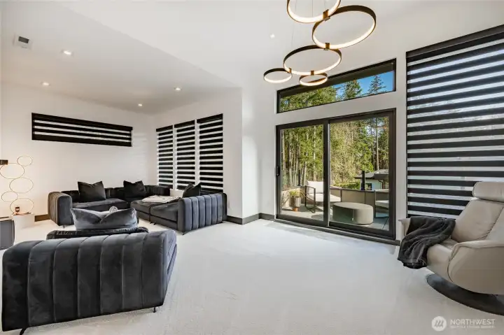 Upper level TV/game room, with private blackout blinds and outdoor deck.