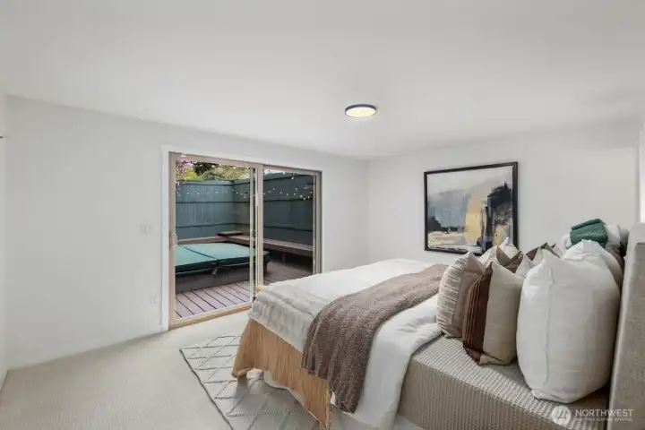 Primary opens up to deck with hot tub