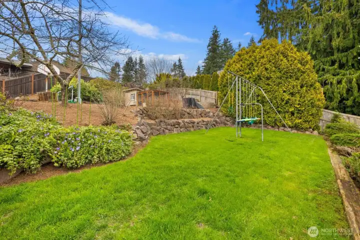 Fully fenced yard with playset