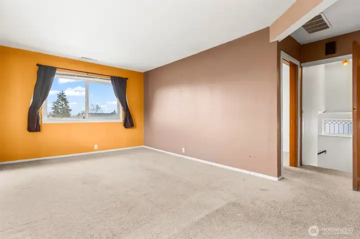 Upper unit of the duplex is accessed through the left front door entrance, then up the stairs to the entry door of the unit.  The bedroom is immediately to the right as you come through the front door - this is the living and dining room