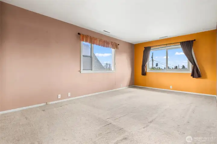 Upper level living / dining room has two large windows for wonderful natural light