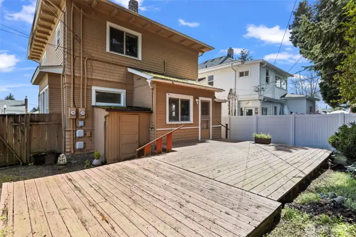 Small lower window is the main unit bedroom, large lower window is the lower unit kitchen.  Large upper window is the upper unit kitchen.  Shared yard and small storage shed for yard tools.