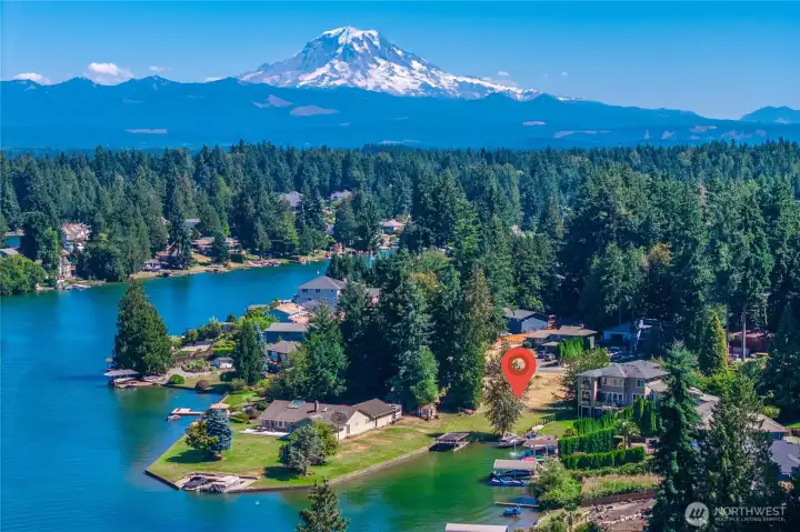 Welcome to Lake Tapps! This lovely lakefront lot is ready for you to build! Located on a protected cove, you can enjoy warmer waters, less boat wake, and a boat house to park your power or pontoon boat! There is 50' of frontage.