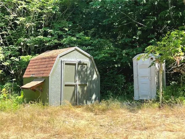 Shed and portable toilet.