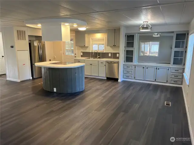 Looking at the kitchen and dining room from great room.