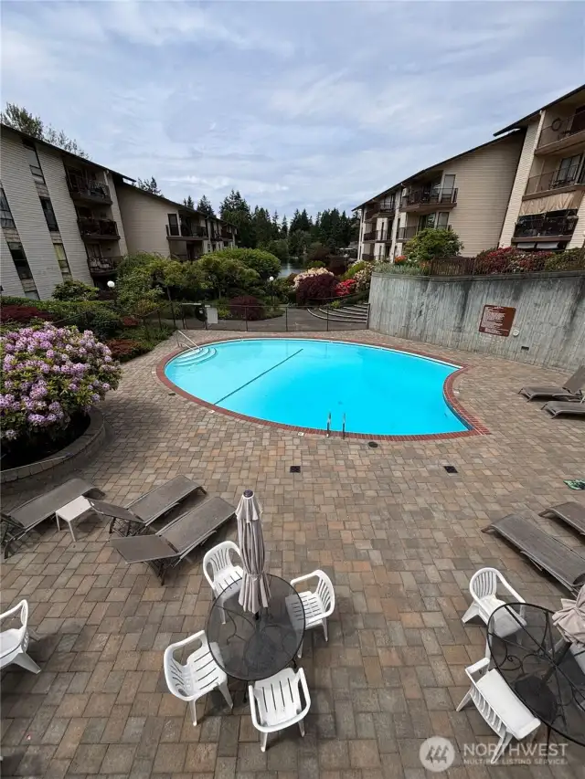 Heated pool open for summer and looking out to Bitter Lake with beach & dock