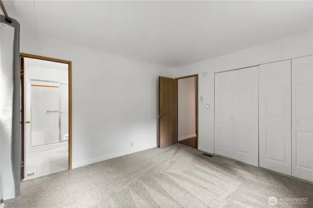 Primary bedroom with walk in bathroom.