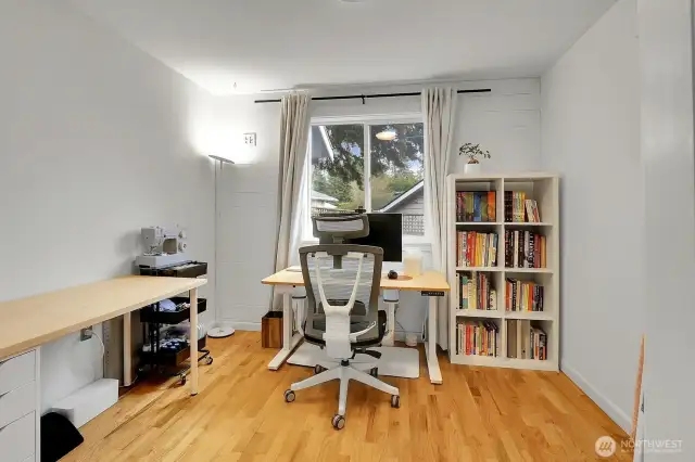Another bedroom is used as a sewing hobby room.
