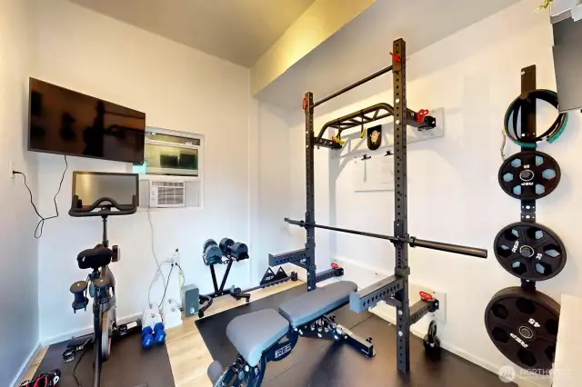 This home gym has all the equipment needed for workout routine.