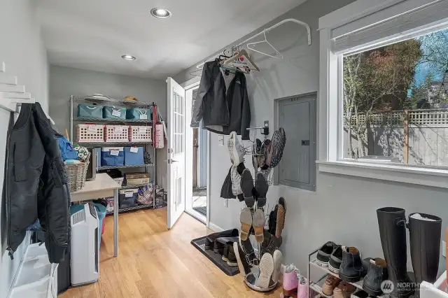 Another angle of the generous storage space in the mud room/utility room.