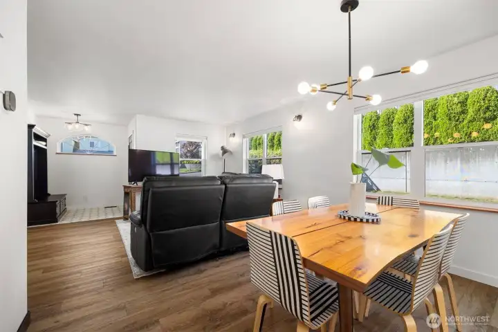 Looking toward the entry from the dining area which is between the living room and the kitchen.
