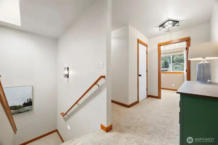 At the top of the stairway you will see the hallways are wide as well as the stairs.