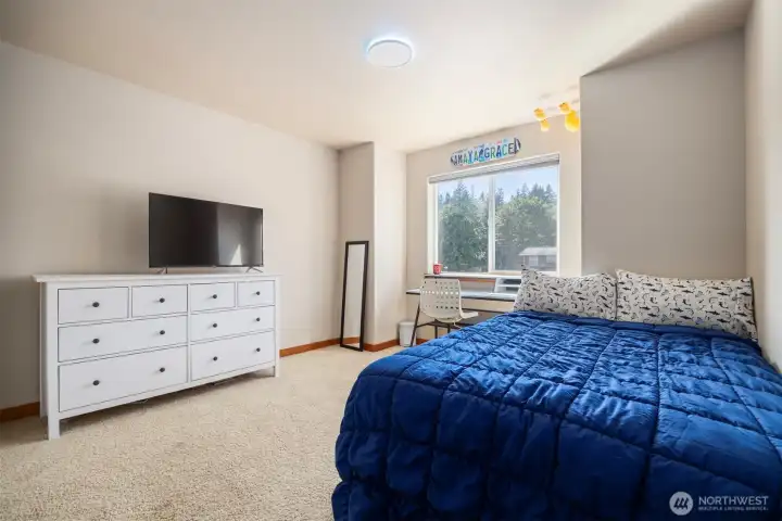 The second bedroom also looks out toward the front of the home and is quite large.