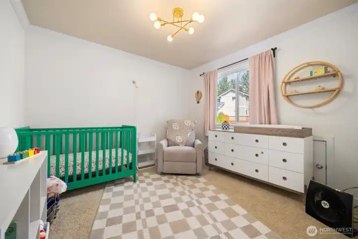 The fourth bedroom is quite spacious as well and it looks out toward the rear yard.