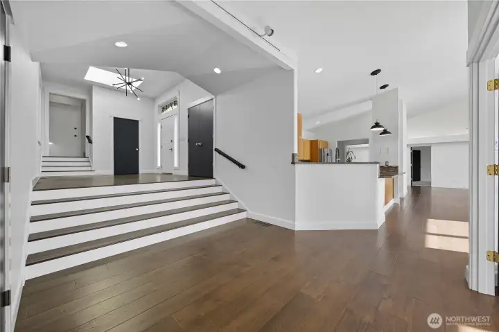 Open Concept Layout -   A modern open-concept floor plan highlights high ceilings, abundant natural light, and a perfect flow between kitchen, dining, and living areas.