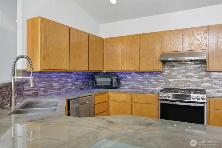 Chef’s Kitchen -  Contemporary kitchen design with stylish finishes, upgraded fixtures, and high-end gas range — ideal for cooking and entertaining.