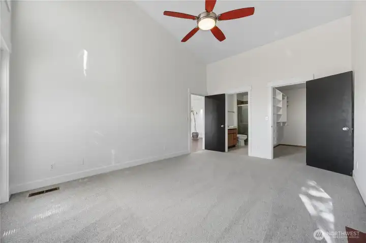 Primary Bedroom #2 - This versatile secondary suite features vaulted ceilings, oversized windows, and direct access to the private deck, blending indoor comfort with outdoor tranquility.
