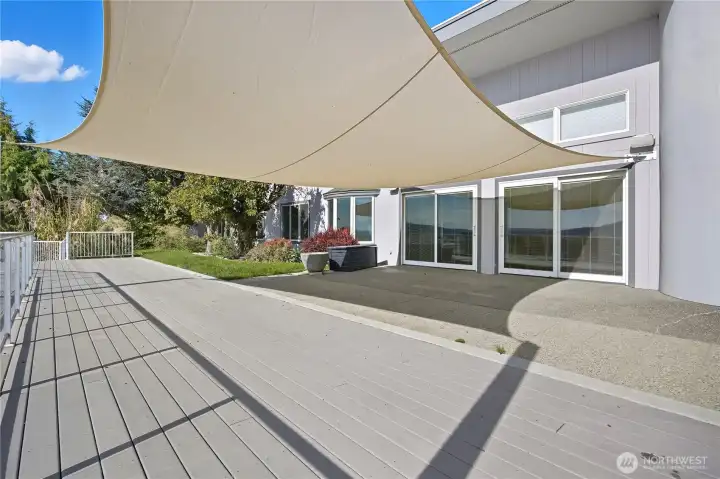 Patio -   Expansive patio shaded by a stylish sail canopy — ideal for outdoor dining, lounging, or hosting gatherings while taking in scenic views.