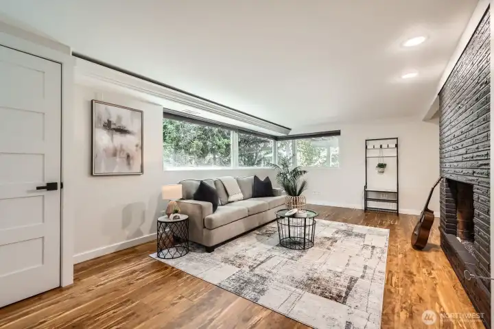 The lower level living room is bright with southwest-facing windows