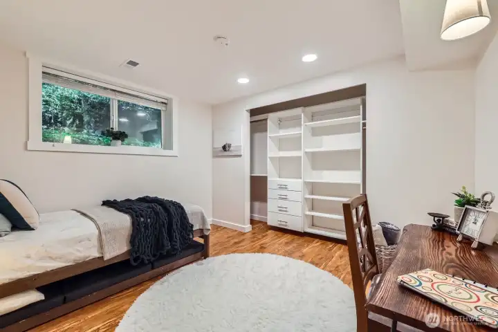 The rear guest bedroom is large and has a custom built-in closet system. A closet door has since been added