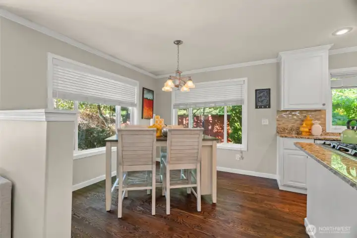 Large breakfast nook, ideal for busy mornings. Breakfast nook overlooks the lush backyard.