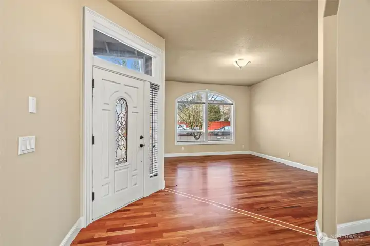 Entry way, nice wide foyer and front living room. Inlayed Brazillian Cherrywood floors.