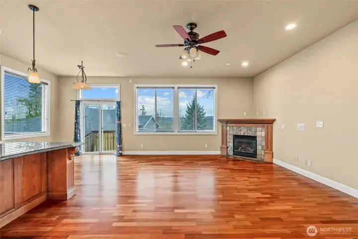 Kitchen with easy flow into family room, gas fireplace.
