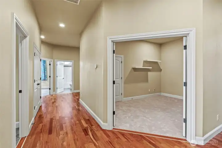 Wide hallways, wood floors throughout.
