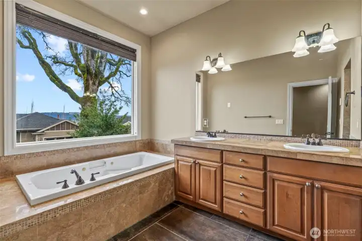 Primary bath with jetted tub, double vanity and heated floors