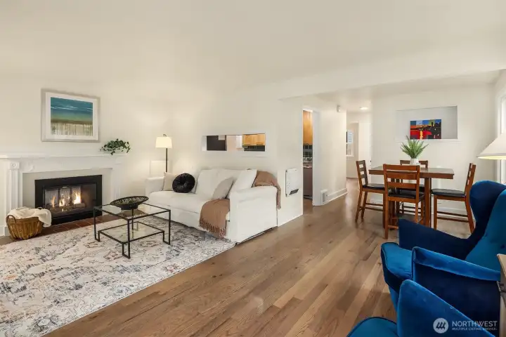 Formal living room off the front entry with cozy two sided fireplace