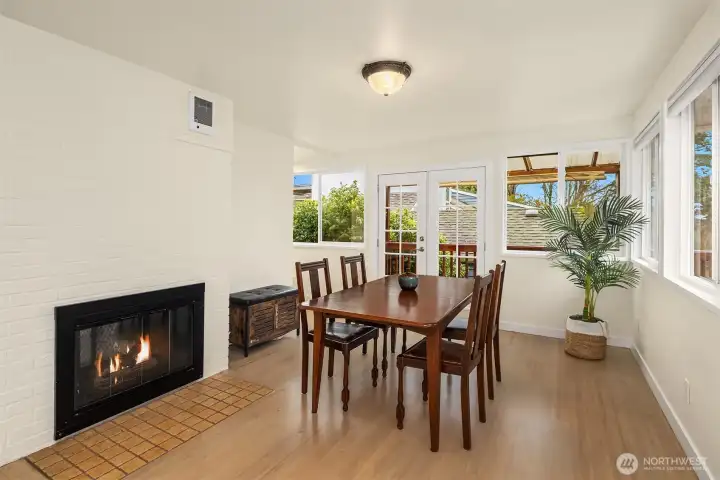 French doors off the dining room lead to a wrap around deck