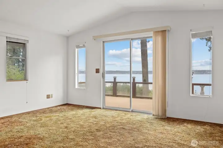 Slider door to large outdoor deck and sweeping views