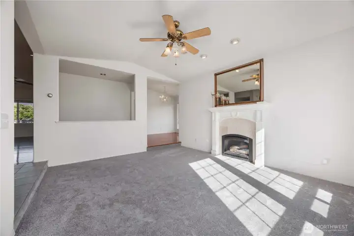 Sunken living room with cozy propane fireplace—perfect for relaxing and gathering
