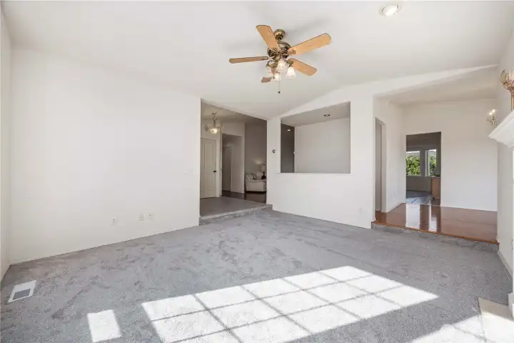 Seamless flow from sunken living room and kitchen into a gorgeous formal dining room—ideal for entertaining and everyday living